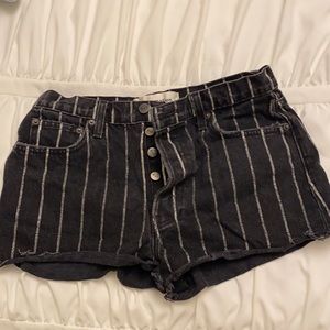 Black and white striped Reformation button up shorts.